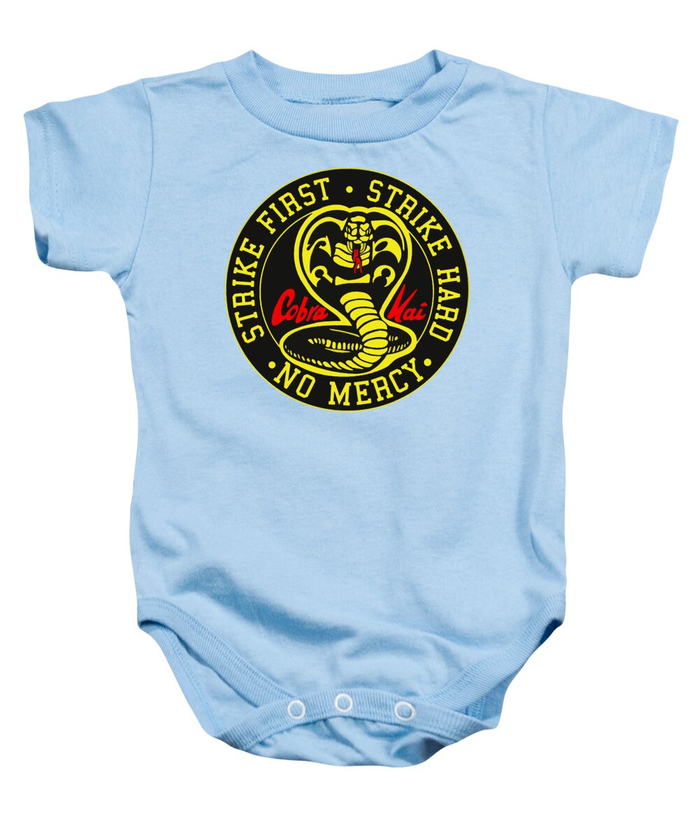 Light blue baby onesie with short sleeves, snap-button legs, and round karate logo graphic