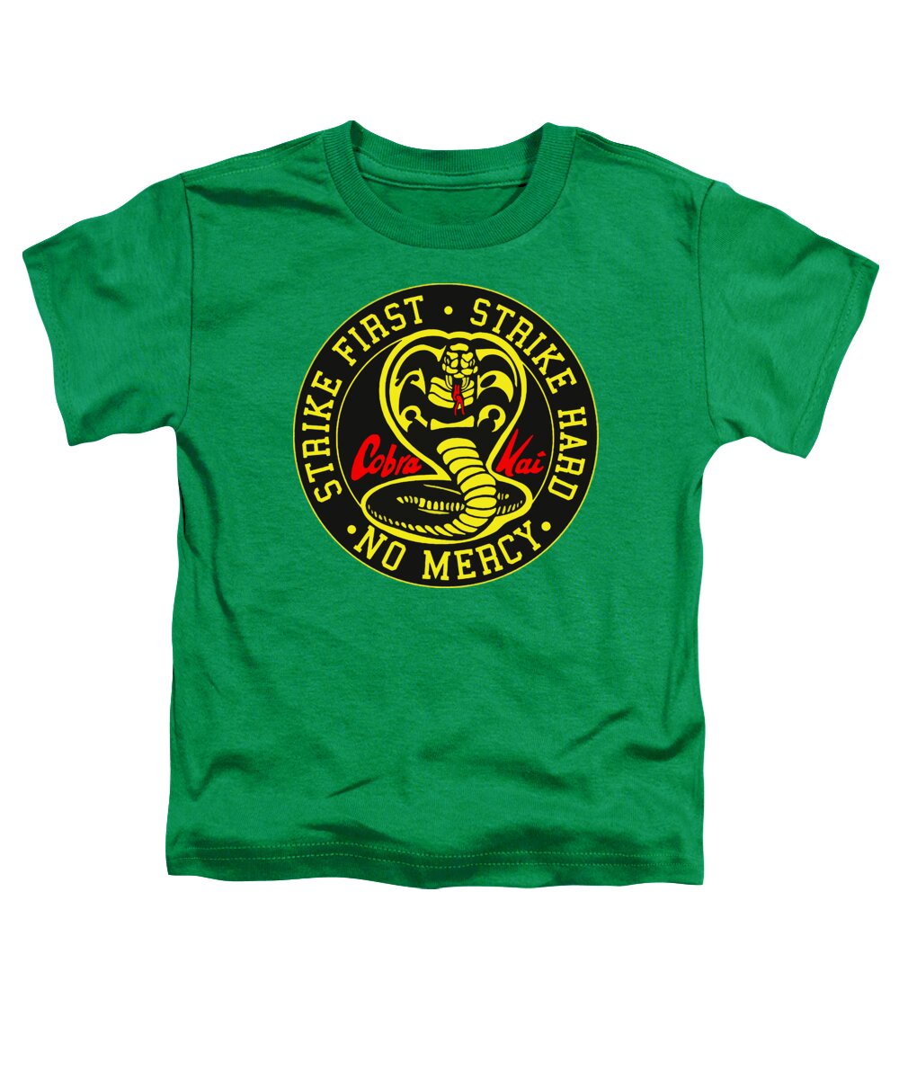 Toddler graphic t-shirt in Kelly green with Cobra Kai Strike First emblem at center