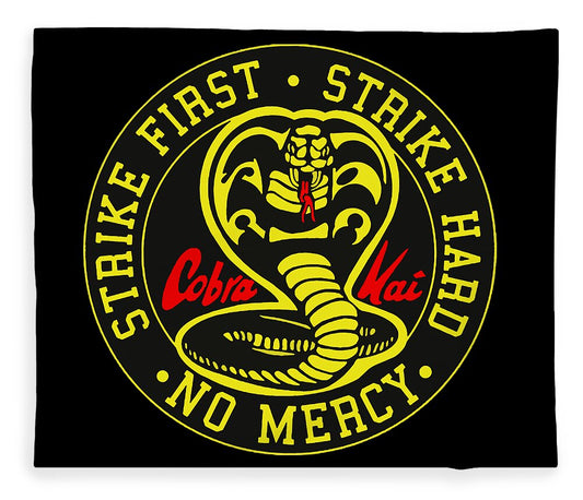 Black throw blanket with yellow circular Cobra Kai graphic and red text