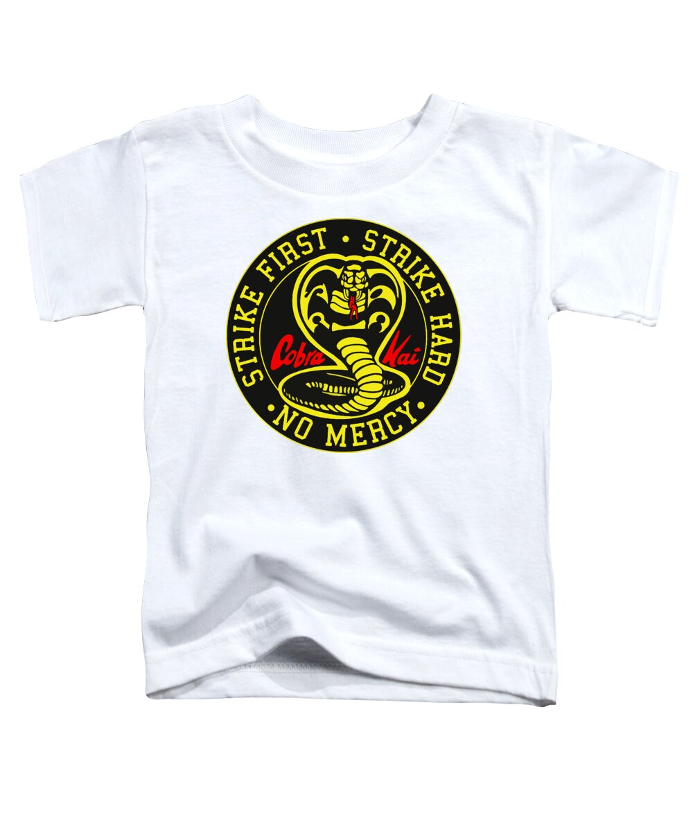 Toddler white graphic t-shirt with circular snake emblem and “Strike First” text