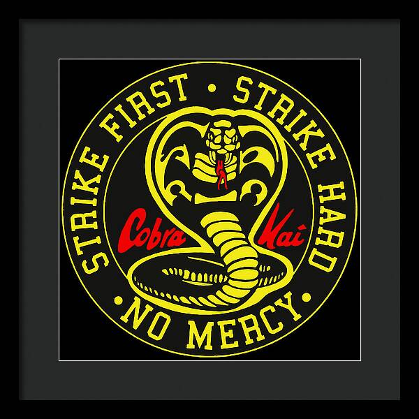 Framed wall print with black frame, circular Cobra Kai emblem on black background