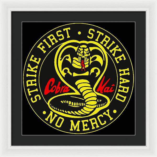 Framed wall print of circular Cobra Kai logo on black, yellow text, white frame