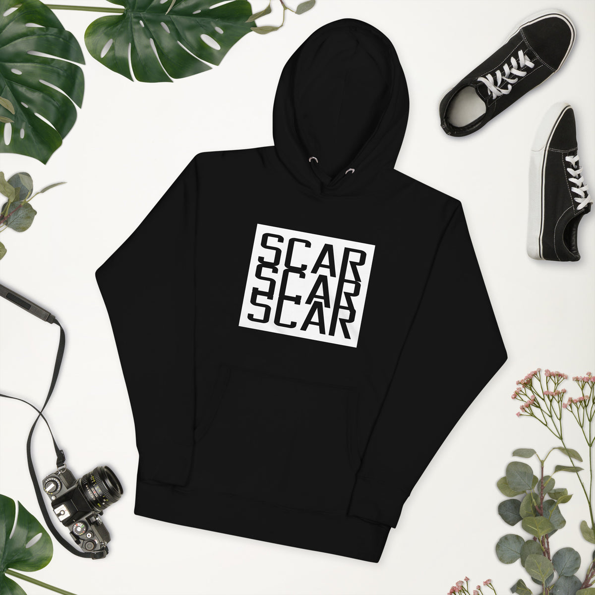 Black unisex hoodie flat lay with large white SCAR logo centered, hooded neckline