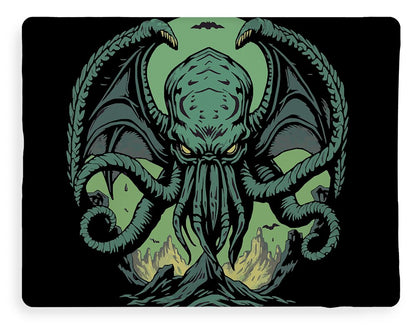 Throw blanket with symmetrical Cthulhu demon emblem graphic in dark green on black