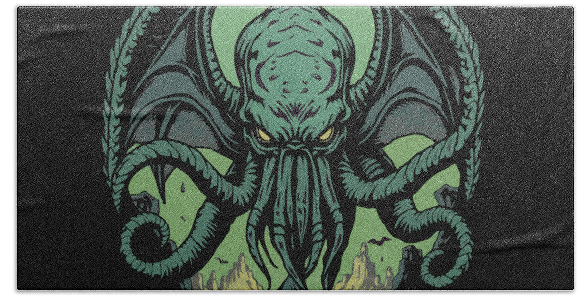 Oversized beach towel featuring teal-green sea demon head artwork