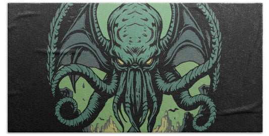 Beach towel with green Lovecraft-style sea demon face graphic
