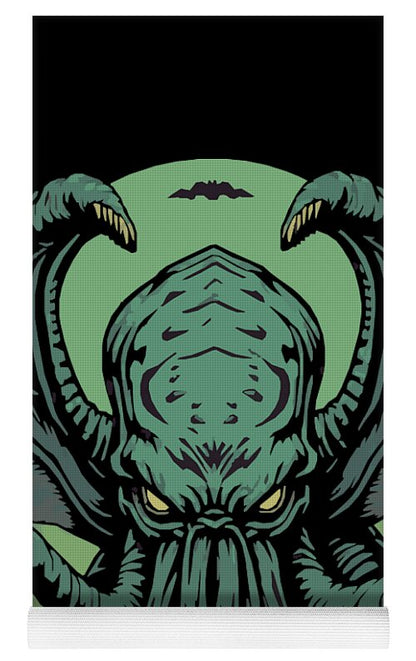 Yoga mat close-up of Cthulhu demon face graphic with textured grippy edge