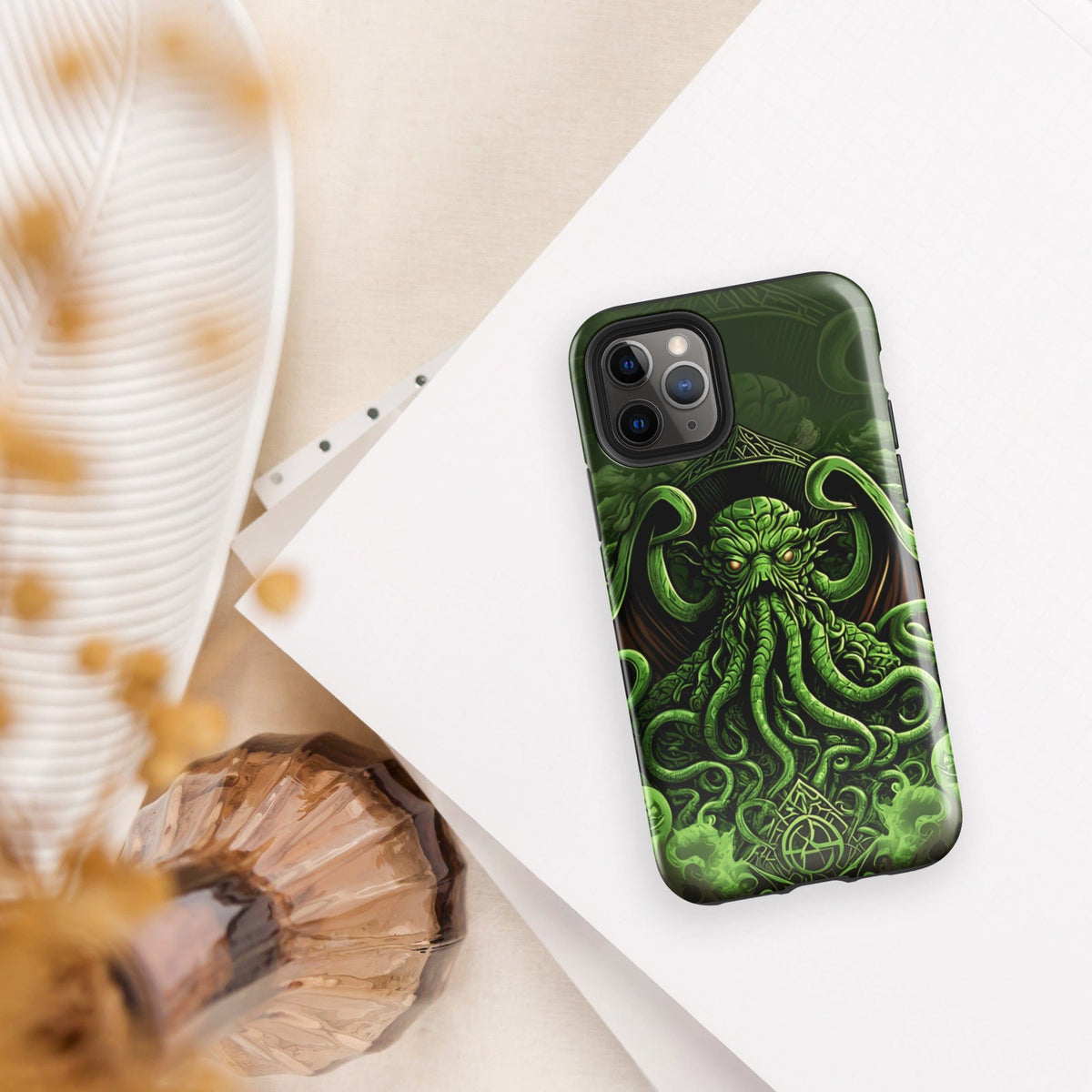 Tough phone case, 3/4 view, with Cthulhu tentacled art in dark green and bright accents.