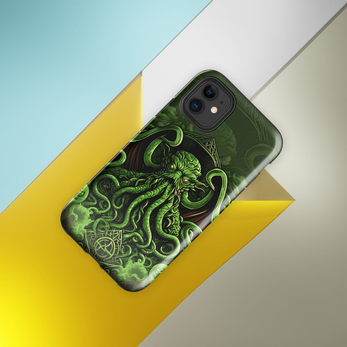 Tough phone case, angled view, with Cthulhu tentacled art in dark green and neon glow.