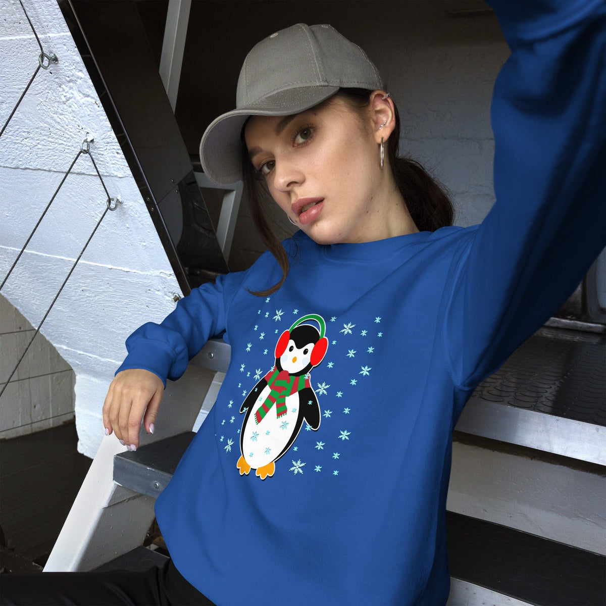 Royal blue crewneck sweatshirt with long sleeves and a penguin graphic on the front.