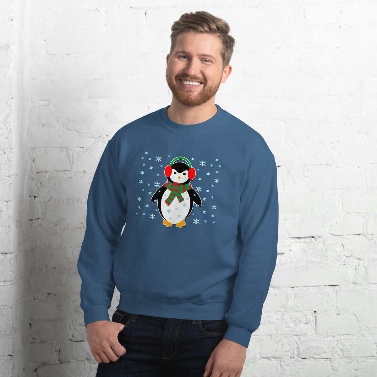 Blue sweatshirt with long sleeves featuring a cute penguin graphic with snowflake accents.