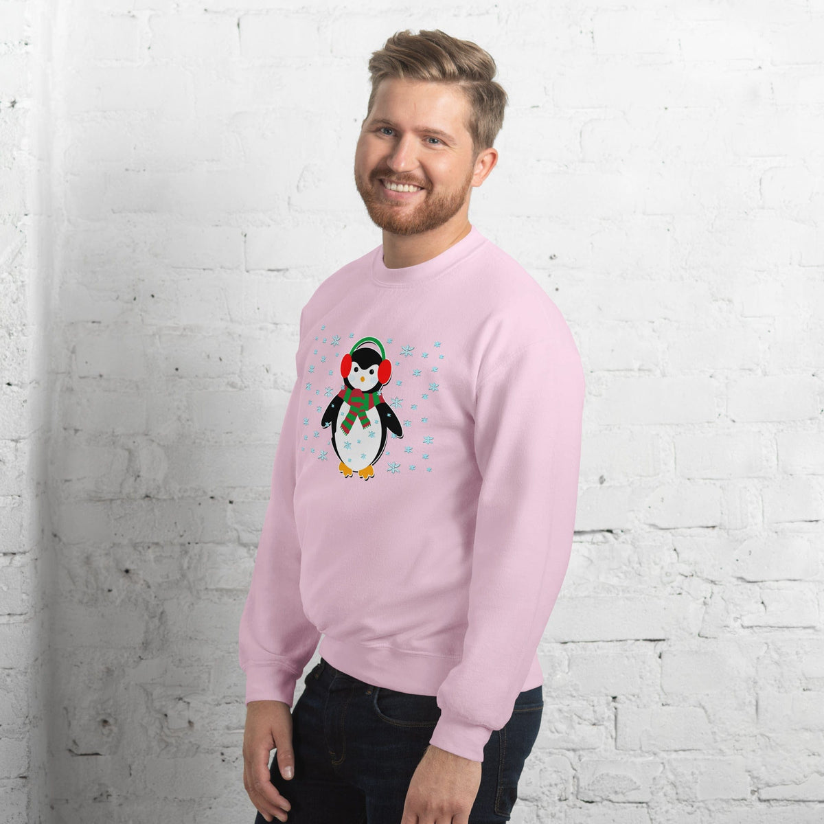 Light pink sweatshirt with long sleeves and a colorful penguin graphic on the chest.