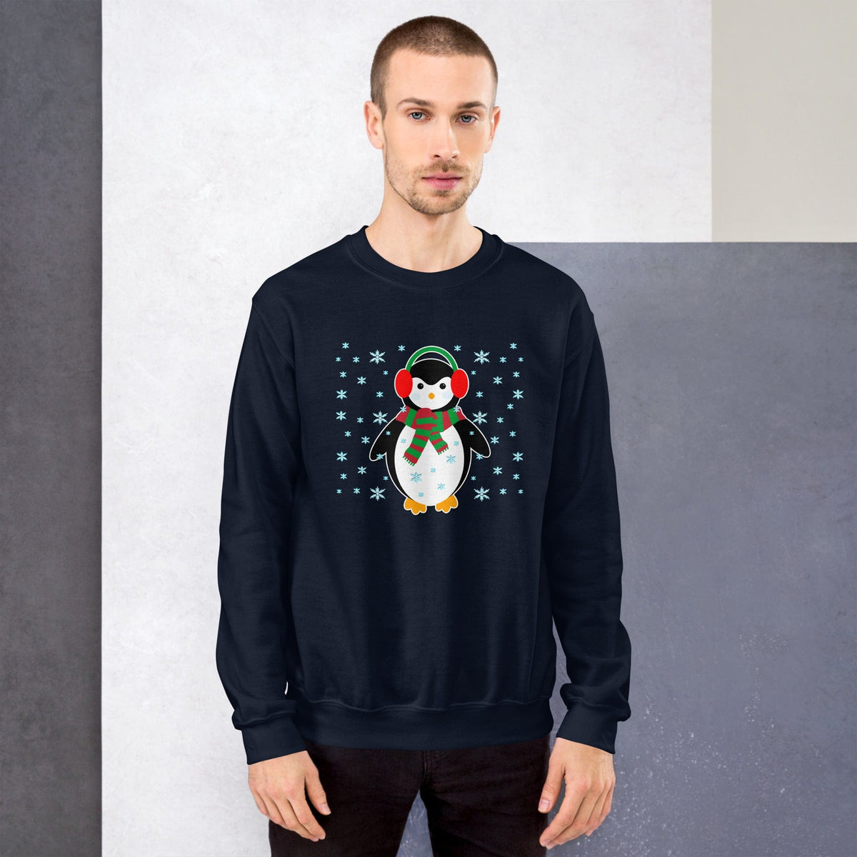 Navy crewneck sweatshirt with long sleeves and a cute penguin illustration on the chest.