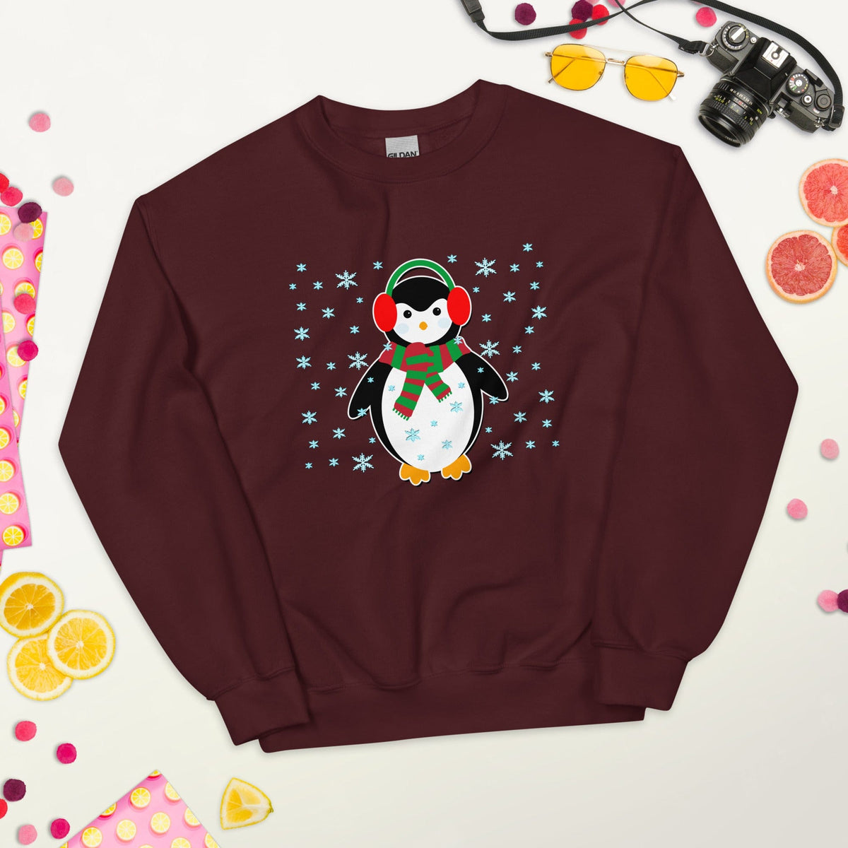 Maroon crewneck sweatshirt with long sleeves and a penguin graphic printed on the front.