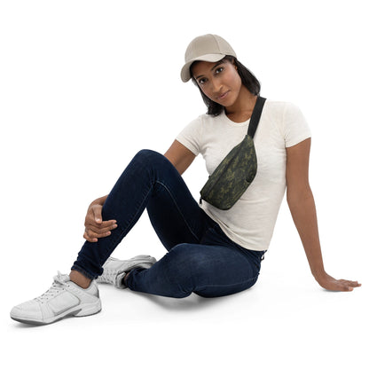 Digital camo fanny pack worn across chest, olive-green bag with black strap