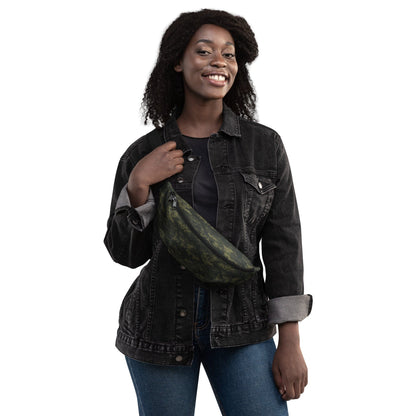 Camouflage waist bag worn diagonally with black strap on denim jacket