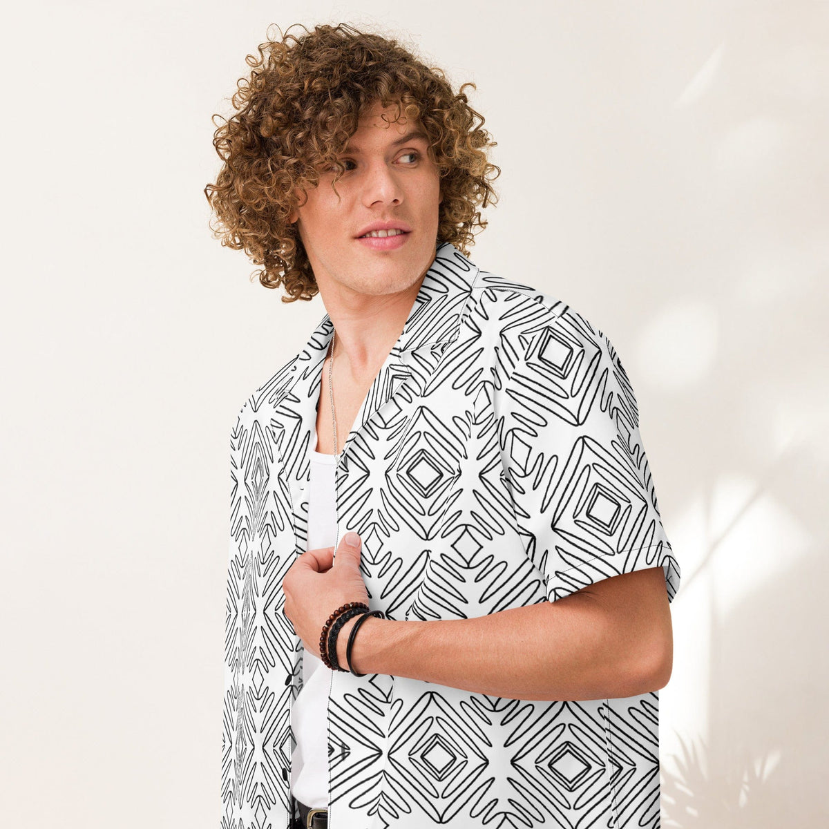 Unisex button-up shirt worn open at the collar, white with black doodle print