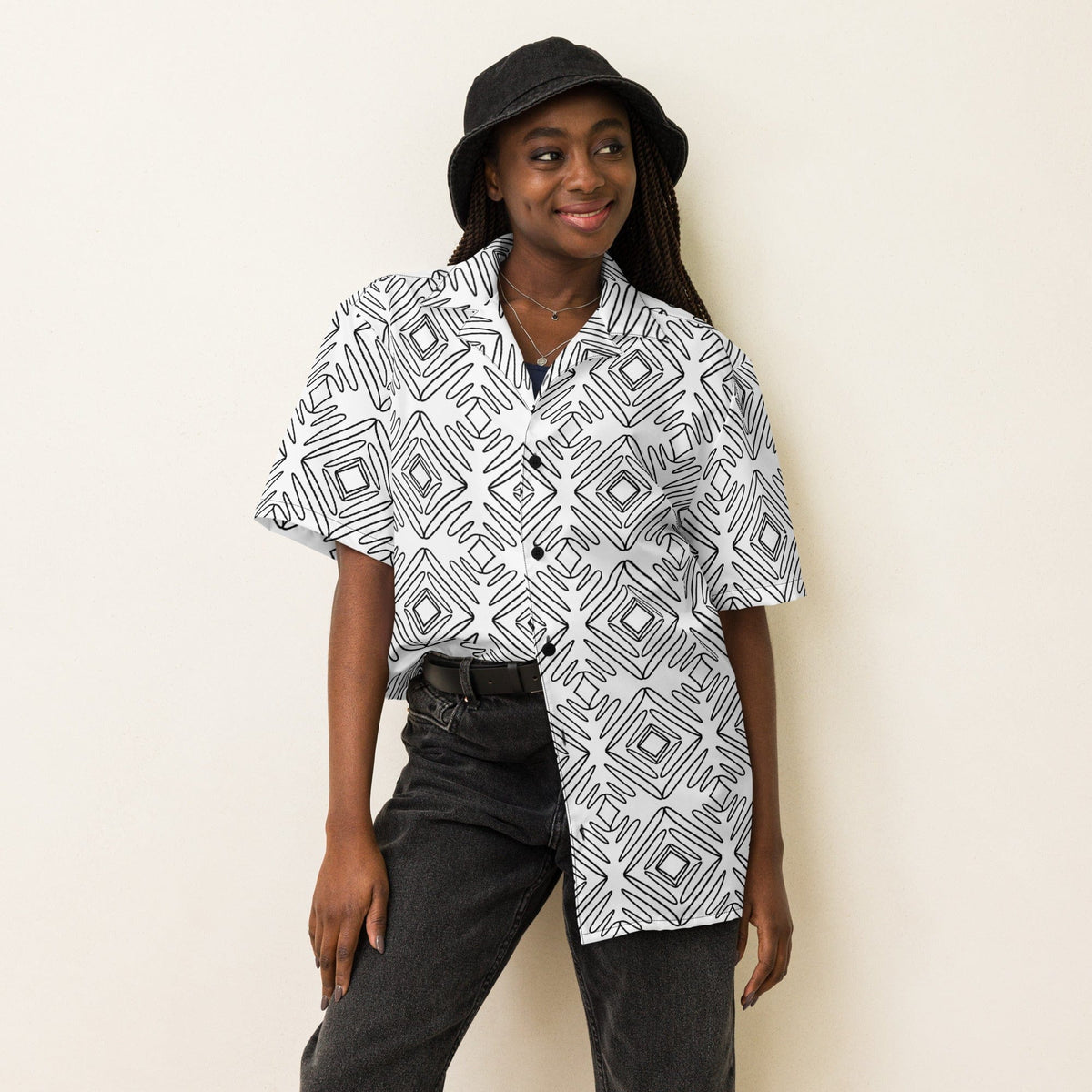 Unisex button-up shirt with white base and black abstract doodle print, short sleeves