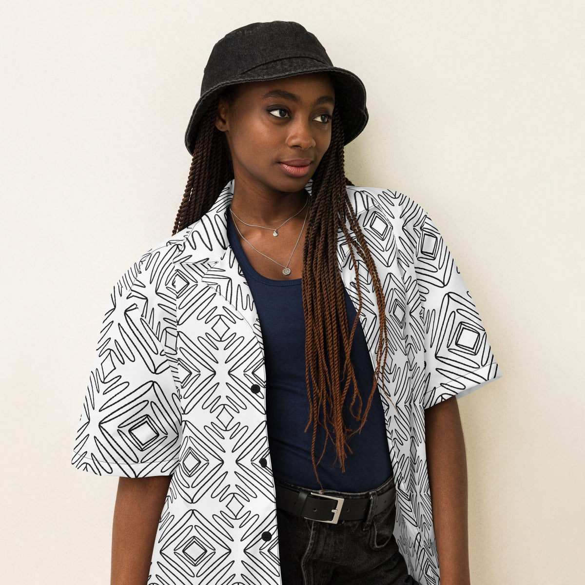 Unisex button-up shirt worn open at collar, white with black doodle geometric pattern