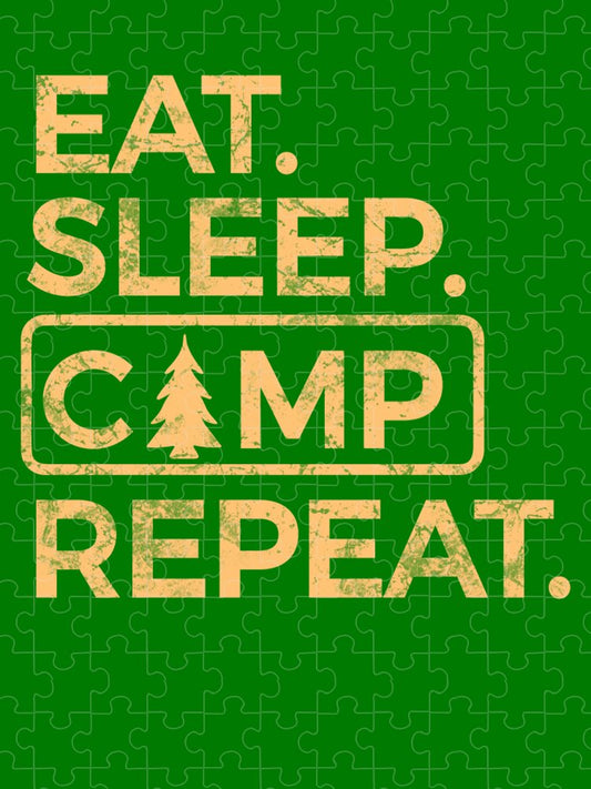 Green jigsaw puzzle showing EAT. SLEEP. CAMP REPEAT. and pine tree