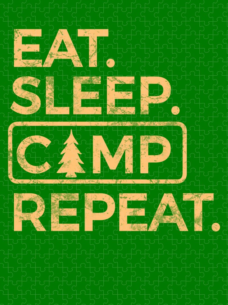 Green jigsaw puzzle with CAMP badge featuring a pine tree between EAT and REPEAT