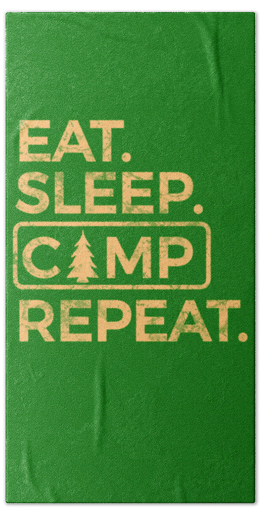 Green beach towel with 'EAT. SLEEP. CAMP REPEAT.' printed graphic and border.