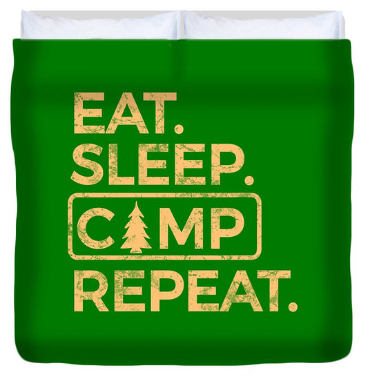 Green duvet cover with Eat Sleep Camp Repeat graphic text in tan and white