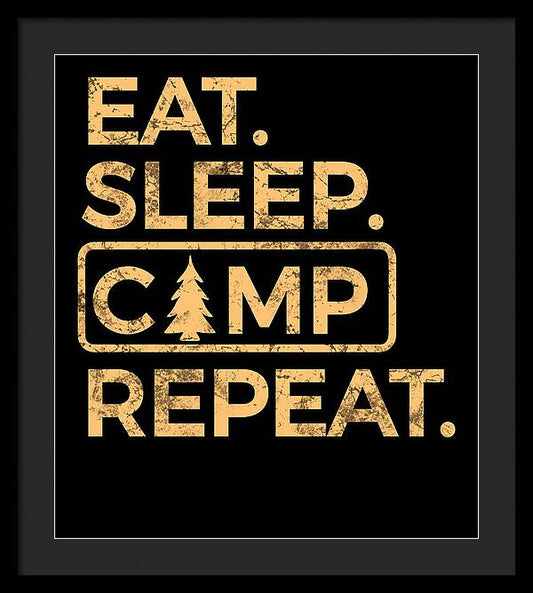 Black-framed wall print with black mat and gold “EAT SLEEP CAMP REPEAT” lettering