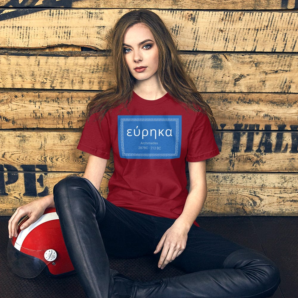 Red crewneck T-shirt with blue “εύρηκα” quote graphic on front.