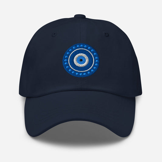 Navy dad hat with embroidered blue evil eye emblem on the front panel