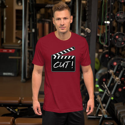 Burgundy T-shirt with film clapper “CUT!” graphic on the chest.