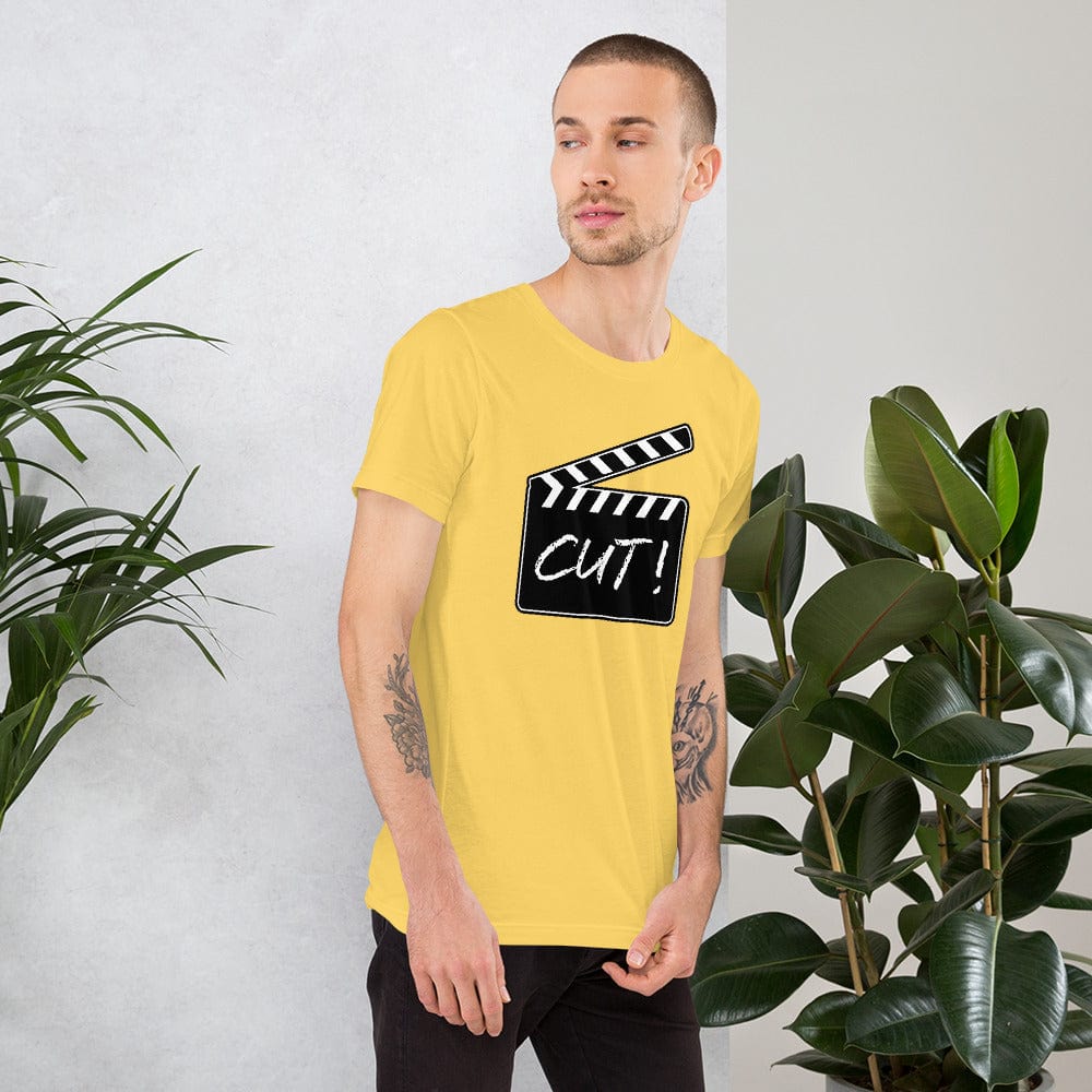 Yellow T-shirt with film clapper “CUT!” graphic on the chest.