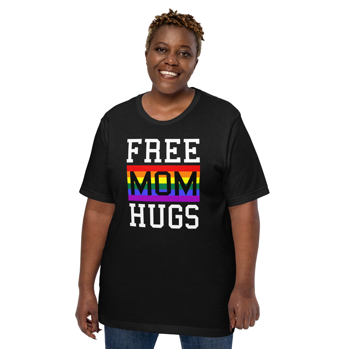 Black T-shirt worn by a person, with “FREE MOM HUGS” text and a rainbow stripe graphic.