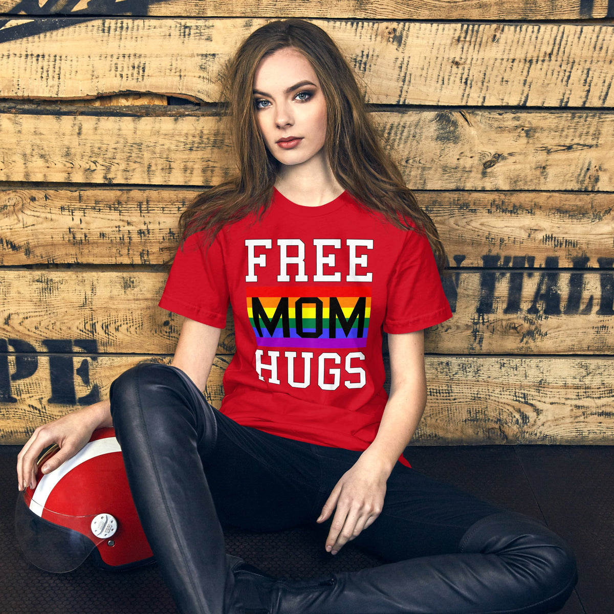 Red T-shirt with “FREE MOM HUGS” text and a rainbow stripe graphic on the front.