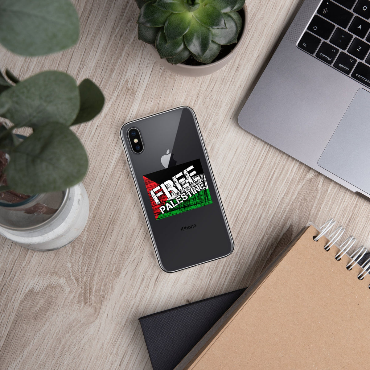 Clear iPhone case with “FREE PALESTINE” graphic on a dark phone back