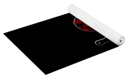 Yoga mat shown flat with rolled edge; black and red speckled '3' graphic