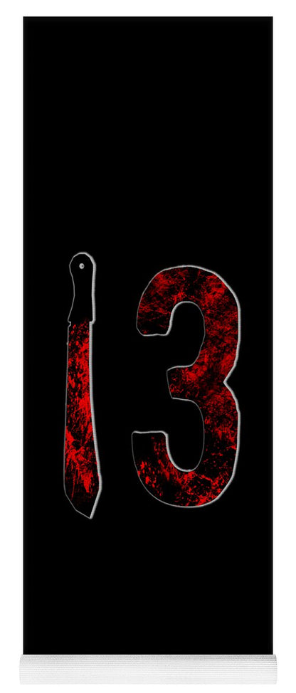 Yoga mat with black surface and red speckled '3' graphic