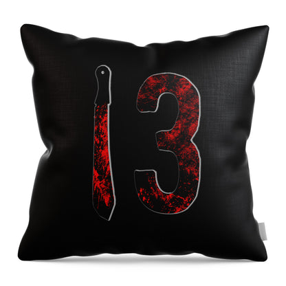 Throw pillow with black cover showing a large red number 3 and vertical dagger design