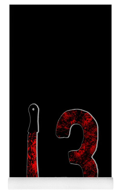 Yoga mat with black surface, red speckled '3', and white ribbed edge strip