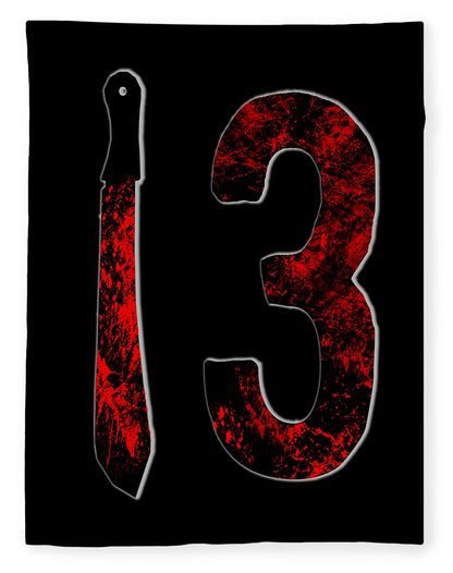 Black fleece blanket with distressed red “3” graphic and hanging dagger icon