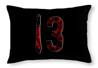 Throw pillow with black cover and red "13" graphic