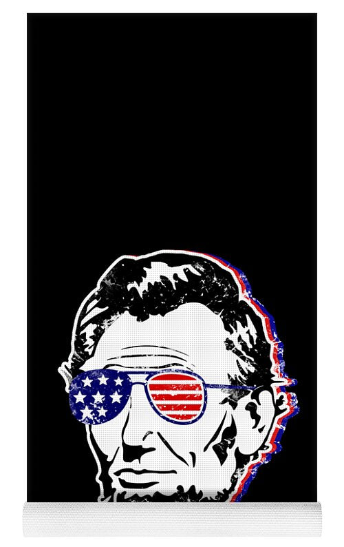 Black yoga mat with Abe Lincoln face graphic and stars-and-stripes sunglasses, bottom trim visible