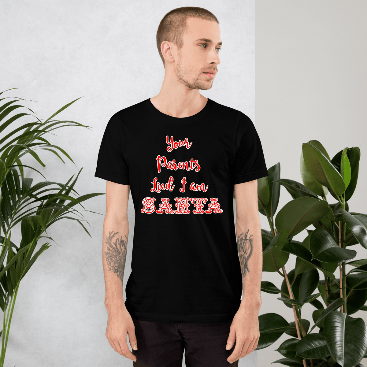 Black Santa-themed T-shirt with red and white 'Santa' text graphic on model