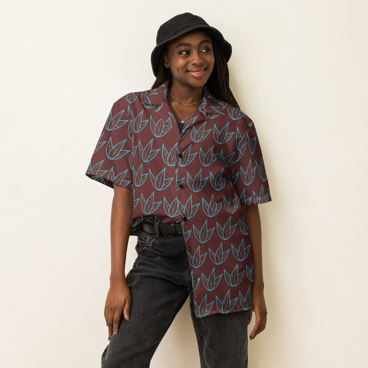 Unisex short-sleeve button-up shirt in dark maroon with teal leaf motif.