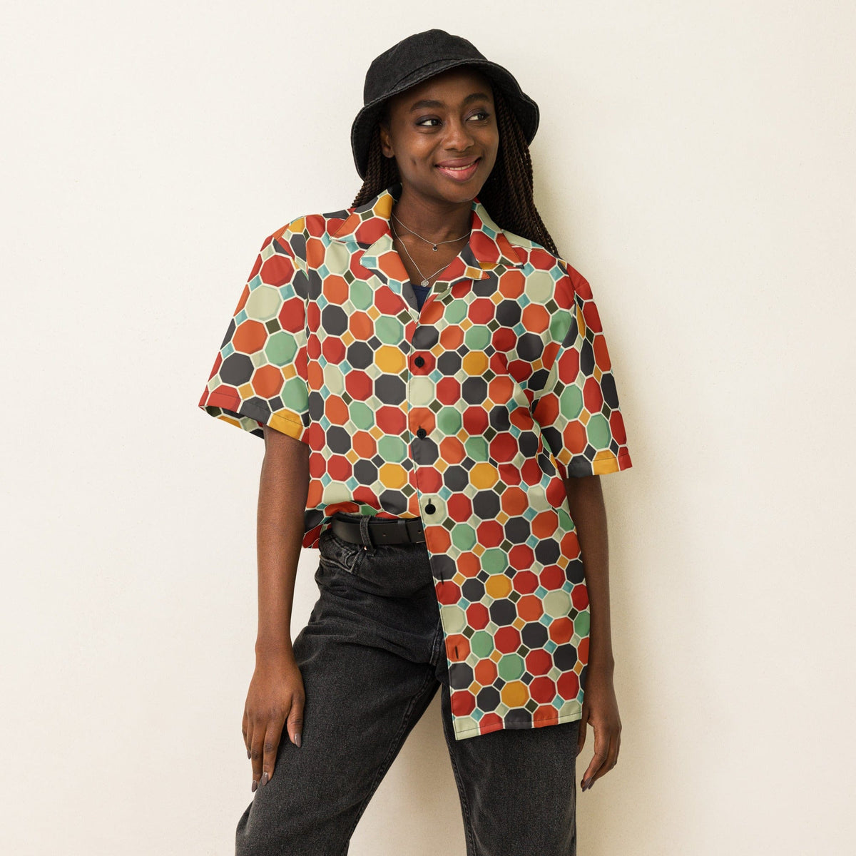Multicolor patterned short-sleeve button shirt with collar, worn with dark pants