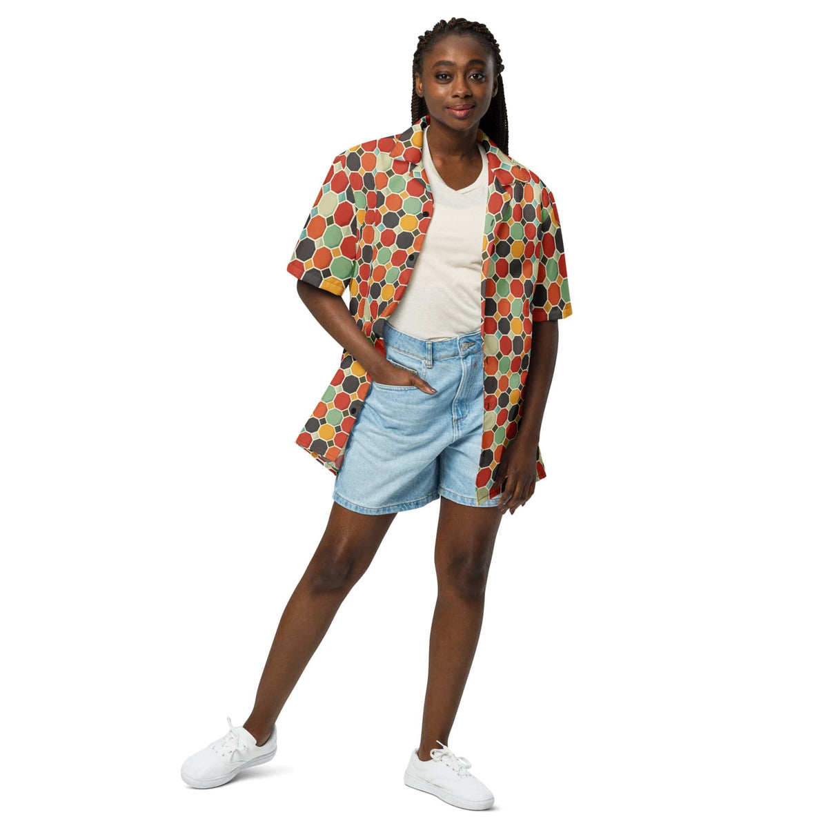 Multicolor patterned short-sleeve button shirt with collar, worn over a light top