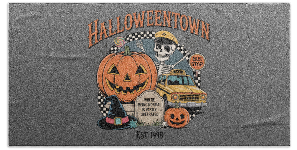 Gray bath towel with Halloween Town graphic and pumpkin, skull, and bus stop design.