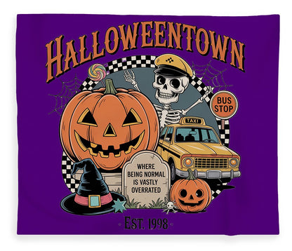 Halloween-themed plush fleece blanket, purple with cartoon pumpkin and taxi graphic
