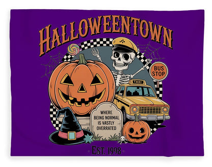 Halloween-themed plush fleece blanket, purple with skeleton, pumpkin, and bus stop design