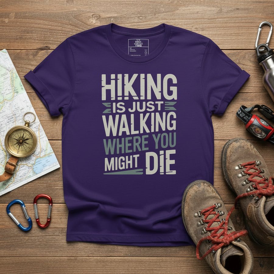 Purple hiking T-shirt with white "HIKING IS JUST WALKING WHERE YOU MIGHT DIE" print